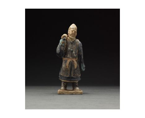 Ca. 1368-1644 AD. Chinese Ming Dynasty Attendant Figure. An elaborately crafted male attendant figure dressed in a deep blue 