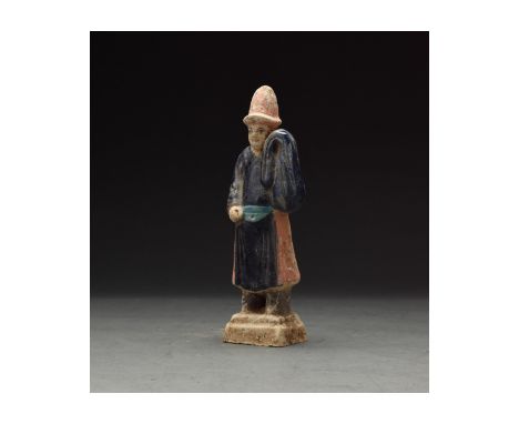 Ca. 1368-1644 AD. Chinese Ming Dynasty Attendant Figure. An elaborately crafted male attendant figure dressed in a dark blue 