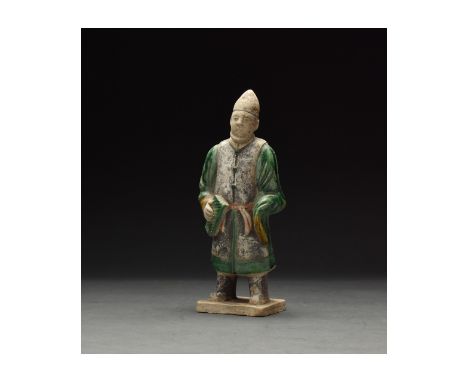 Ca. 1368-1644 AD. Chinese Ming Dynasty Attendant Figure. An elaborately crafted male attendant figure dressed in a green tuni