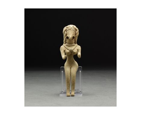 C. 3rd millennium BC. A lovely buff-coloured handmade fertility idol of characteristically abstract form with delineated legs