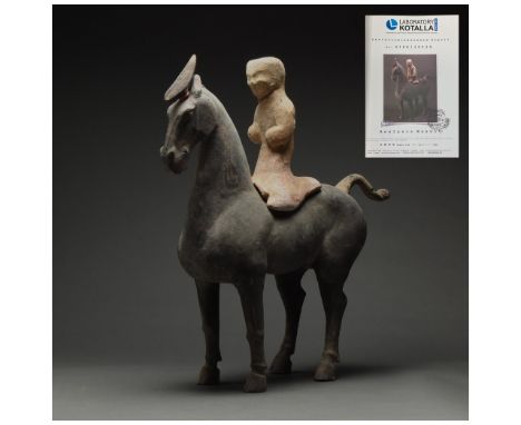 Ca. 202 BC-220 AD. Chinese Han Dynasty. Terracotta Horse with Rider. An elegant hollow-moulded terracotta horse. This black h