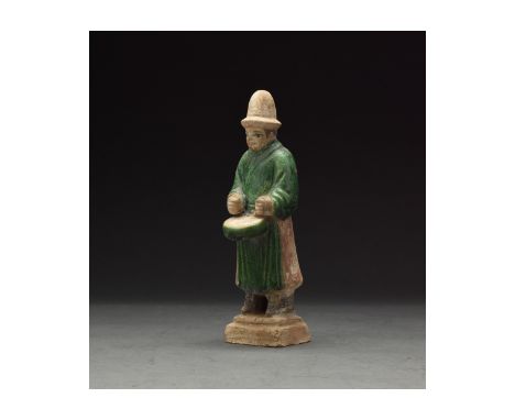 Ca. 1368-1644 AD. Chinese Ming Dynasty Attendant Figure. An elaborately crafted male attendant figure dressed in emerald gree