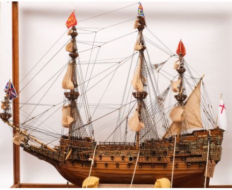 A scale model of HMS Sovereign of The Seas:, fully  rigged and set sails over detailed decks with grates and capstan, open gu