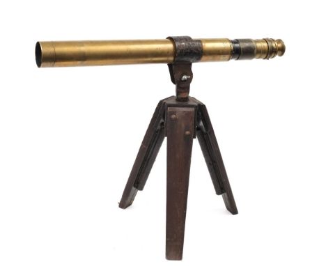 A brass gunsight telescope by Ross, London:, numbered 42539, with adjustable magnification, fitted later eyepiece cover, in a
