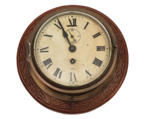 An 8-day bulkhead clock:, unsigned, white enamel dial with Roman numerals and subsidiary seconds dial, on a caved oak mount, 