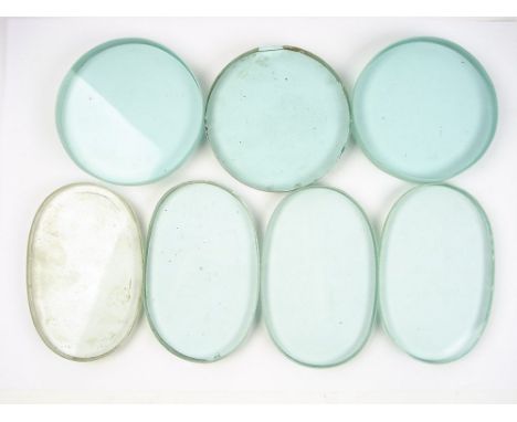 Three circular diving helmet window glasses and two pairs of Siebe pattern oval diving helmet side window glasses: (7)
