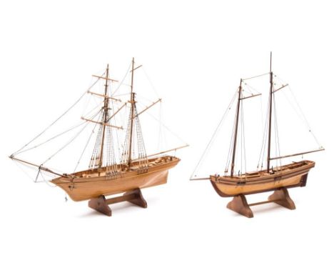 A scale model of a gaff and another of a schooner:, the former with plank and pinned hull, both standing and running rigged w