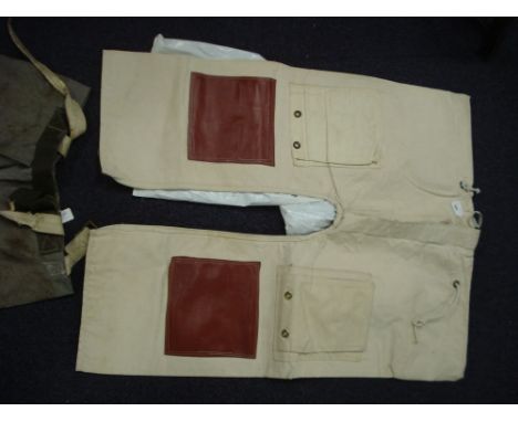 A pair of 'Navy Seascape' chafing pants and one other pair of chafing pants:.