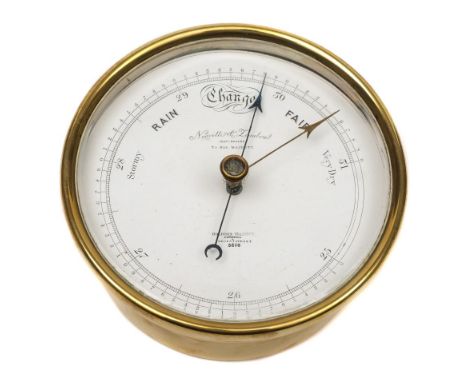 A circular brass cased barometer by  Negretti & Zambra, London:, white enamel calibrated dial signed as per title with blue s