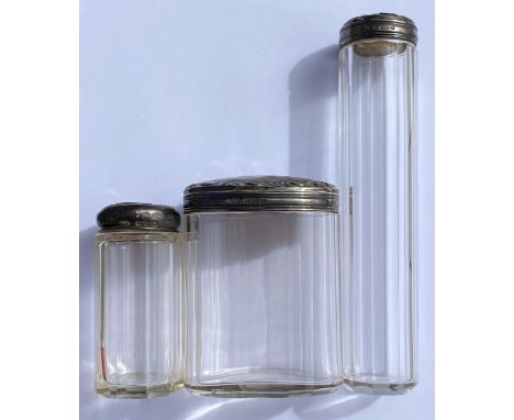 A GROUP OF THREE SILVER TOPPED DRESSING TABLE POTS, 2 X 1910 AND 1 X 1924, HEIGHT OF TALLEST 16 CM, SILVER TOPS GROSS WEIGHT 