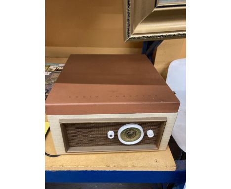 A KB RADIO TUNETIME VINTAGE RECORD PLAYER IN A CASE 