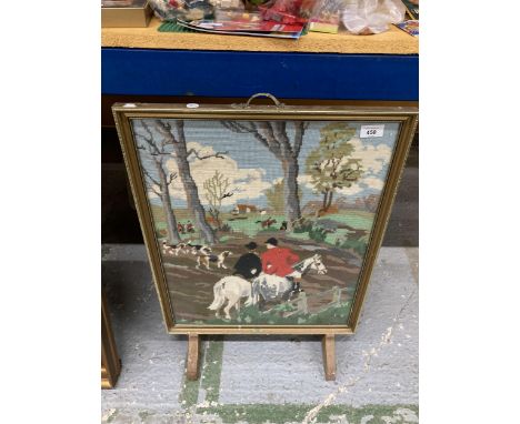 A VINTAGE FIRE SCREEN WITH A TAPESTRY HUNT SCENE WITH A WOODEN AND METAL FRAME, 49CM X 68CM 