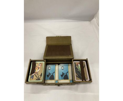 A VINTAGE LEATHER PLAYING CARD BOX WITH PLAYING CARDS 