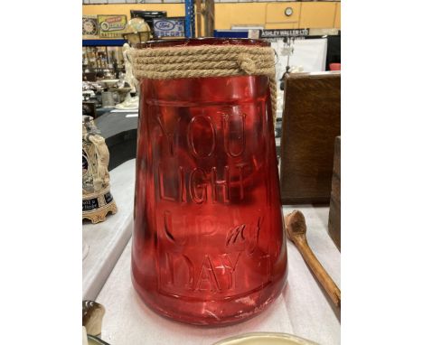 A LARGE RED GLASS YOU LIGHT UP MY DAY URN 