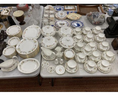 AN EXTENSIVE WEDGWOOD 'MIRABELLE' PATTERN DINNER AND TEA SERVICE COMPRISING LIDDED TUREENS, DINNER PLATES, GRAVY BOATS, CUPS 