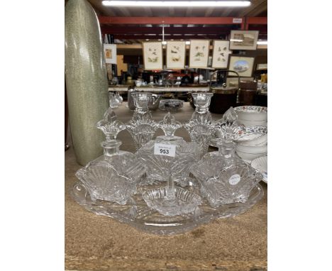 A GLASS DRESSING TABLE SET TO INCLUDE A TRAY, CANDLESTICKS, BOTTLES WITH STOPPERS AND A RING HOLDER 