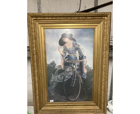 A LARGE PRINT OF A LADY ON A BICYCLE IN AN ORNATE GILT FRAME, 76CM X 103CM 