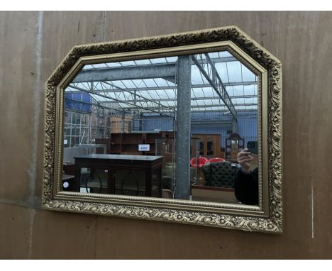 A MODERN GILT FRAMED WALL MIRROR, 33 X 24" 