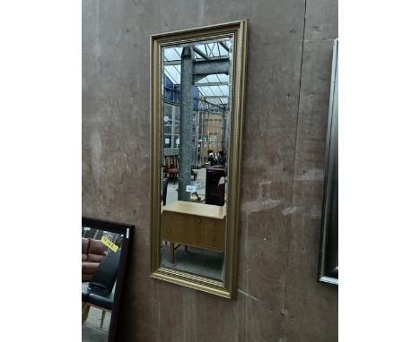 A GILT EFFECT WALL MIRROR, 39 X 15" 