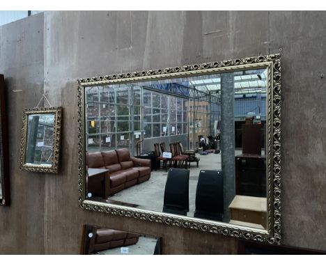A MODERN GILT FRAMED WALL MIRROR, 38 X 27" AND A SMALLER DRESSING MIRROR, 14 X 11.5" 