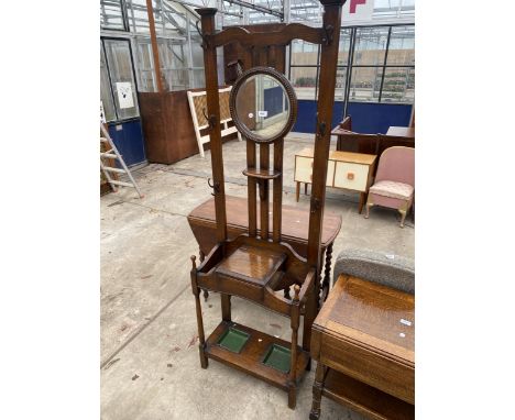 AN EARLY 20TH CENTURY OAK MIRRORED HALL STAND WITH SIX HOOKS AND TWO STICK SECTIONS, 25.5" WIDE 