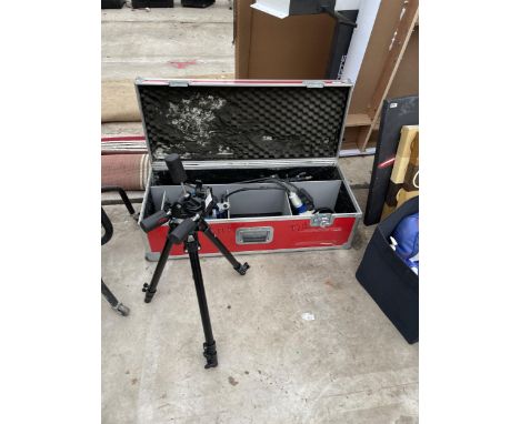 A STORAGE BOX WITH A TRIPOD WORK LIGHT AND A FURTHER TRIPOD CAMERA STAND 