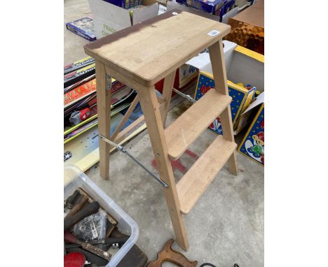 A SMALL WOODEN TWO RUNG STEP SEAT 