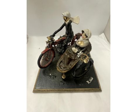 AN UNUSUAL SCULPTURE OF A MAN AND WOMAN ON A MOTORBIKE WITH SIDE CAR, INDISTINCTLY SIGNED, POSSIBLY R.WEBB 
