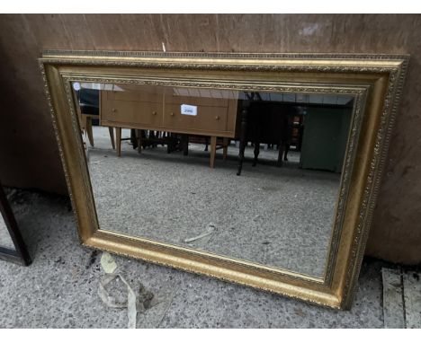 A MODERN GILT FRAMED WALL MIRROR, 34 X 25" 