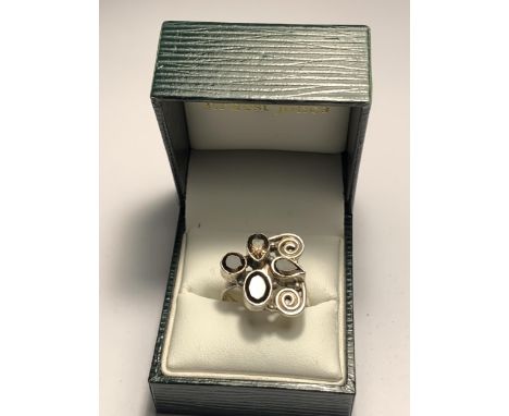 A BOXED SILVER DESIGNER RING 
