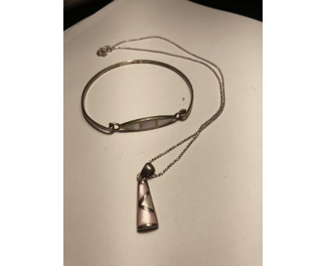 A SILVER BANGLE WITH MATCHING PENDANT ON A SILVER CHAIN 