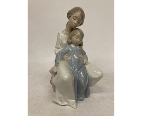 A NAO LLADRO FIGURE OF A GIRL WITH CHILD HOLDING A TEDDY, NO.1429 