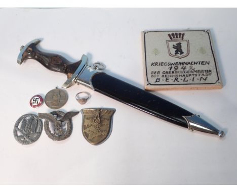 An SS Dagger by Robert Klaas (missing grip emblems and tip of blade), a white metal Ring with skull and crossbones motiff and