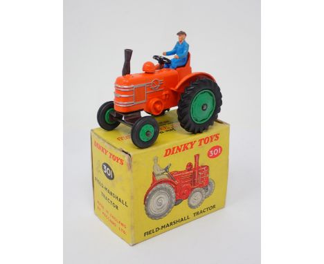 A rare boxed Dinky Toys No.301 Field Marshall Tractor with green plastic front hubs 