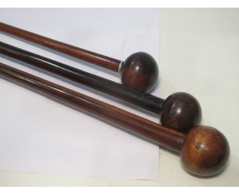 Three vintage hardwood Zulu Knobkerries 