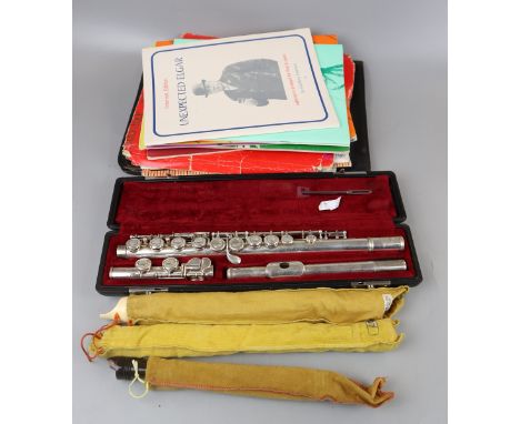 Flute together with recorder and music booksThe flute is marked Yamaha Yfl211s Nippon Gakki co.ltd Japan