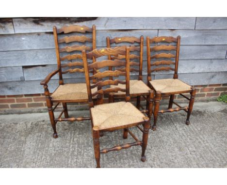 A set of&nbsp;six ash and beech rush seat ladder back dining chairs, on turned and stretchered supports, and two loose cushio