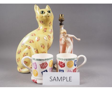 A Karl Ens porcelain table lamp, formed as a nude woman with a pink cloak, 11 3/4" (damaged), a pair of Emma Bridgewater mugs