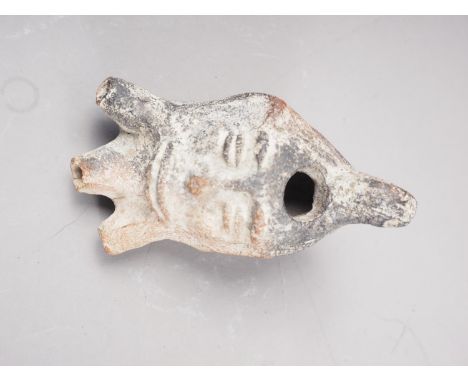 A Roman pottery three-light oil lamp, formed as a bearded man's head, 4" long 