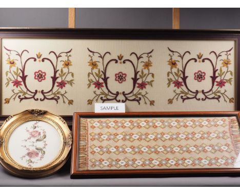 A silk embroidery with scrolled designs, 17 1/4" x 45 1/4", another similar with floral designs, two other fabric panels, a p