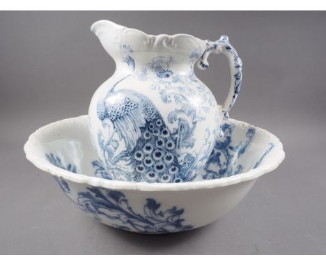 A peacock decorated toilet jug and basin 