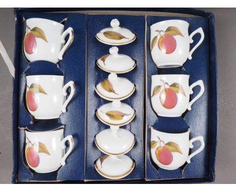 A boxed set of six Royal Worcester "Evesham" pattern chocolate cups and covers, and two glass decanters and stoppers 