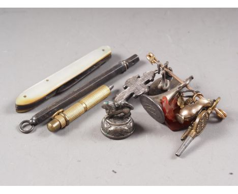 A 9ct gold pin, a number of watch fobs, two propelling pencils and a mother-of-pearl fruit knife 