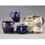 A Royal Doulton stoneware tulip relief decorated sugar and cream set, a Royal Doulton jar, a Royal