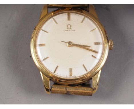 A gentleman's 1960s Omega manual wristwatch with baton numerals, champagne dial and leather inset expanding bracelet, Serial 