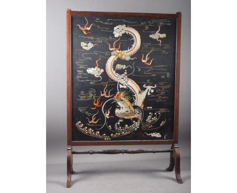 *An early 20th century mahogany framed firescreen with dragon embroidered silk panel, 23 1/2" wide x 35" high&nbsp;(*This lot
