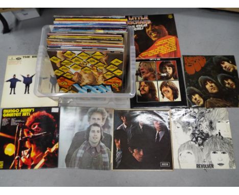 Approximately fifty 33.3 RPM vinyl records to include The Beatles, The Rolling Stones, The Beach Boys, The Kinks, Simon and G