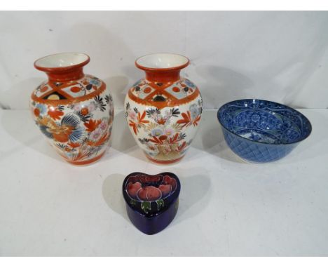 Moorcroft Pottery -  a small Moorcroft Pottery hart shaped lidded trinket box, decorated with anemone on a blue ground, impre