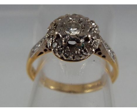 A hallmarked 18 carat gold diamond cluster ring, size K 1/2, approximate weight 3.19 g Est £60 - £90.