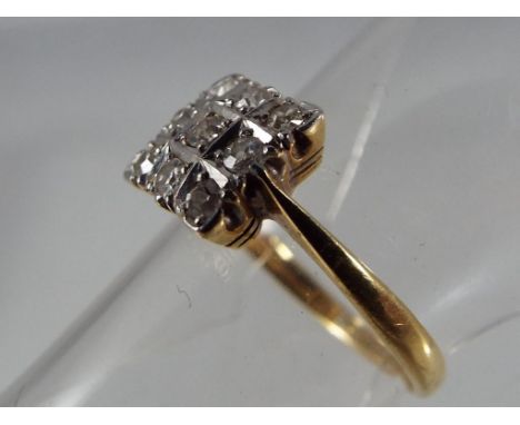 A hallmarked 18 carat gold diamond cluster ring in square design, stamped 18 ct, size K, approximate weight 2.79 g Est £70 - 
